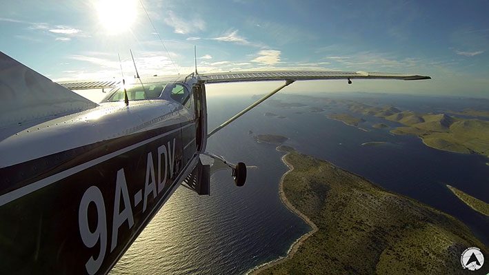 Enjoy the magical beauty of the Croatian coast from an ADV panoramic flight airplane flying panorama